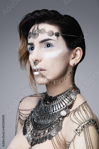 Portrait of a young woman wearing ethnic jewelry