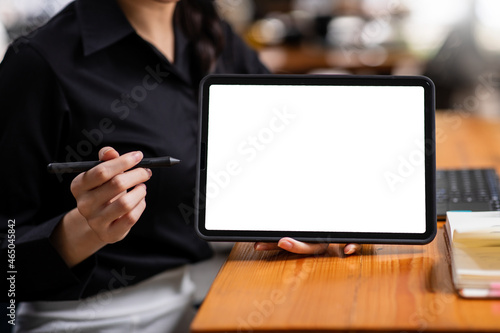Tablet Laptop computer screen mockup, template background banner, Woman hand woking on tablet laptop computer with a blank screen, Business online, e commerce, online study concept