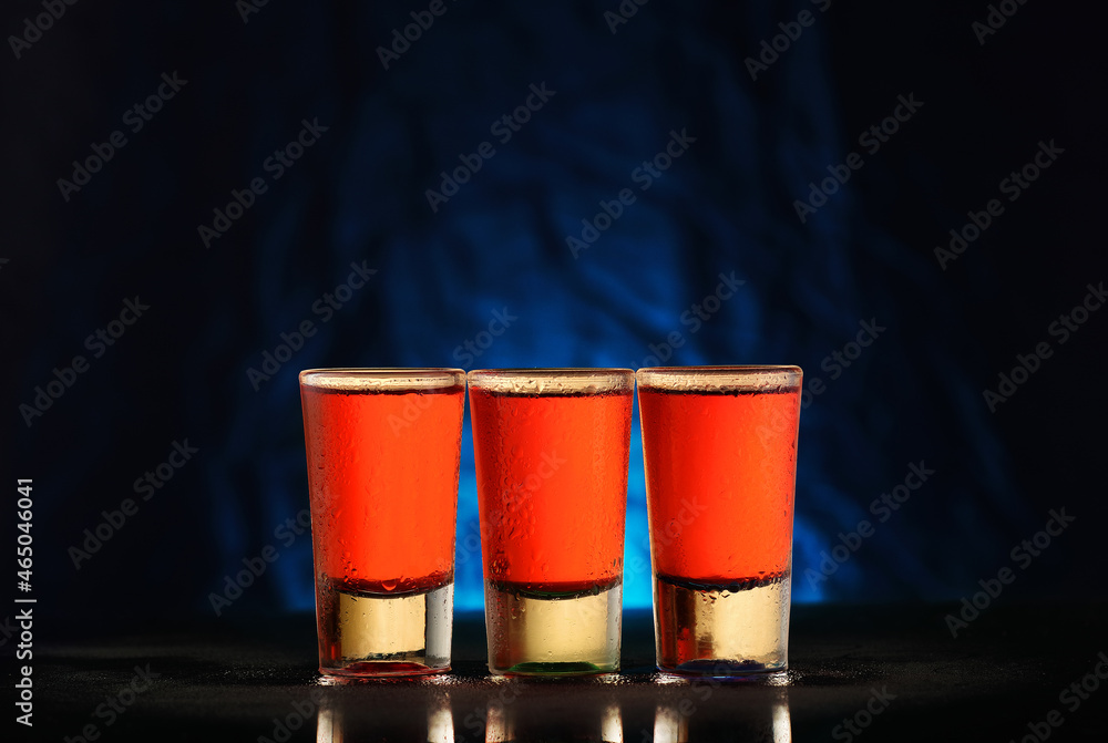 Fototapeta premium three glasses with red alcohol
