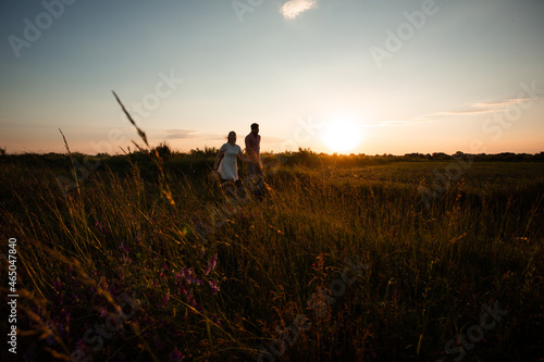 Lovely couple walking in the summer field © oksix