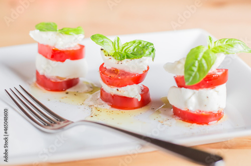 Caprese salad with mozarella cheese,tomatoes and basil.creative option
