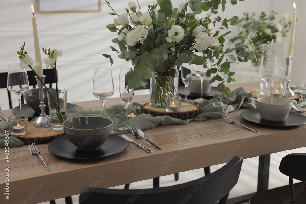 Fototapeta premium Festive table setting with beautiful tableware and decor indoors