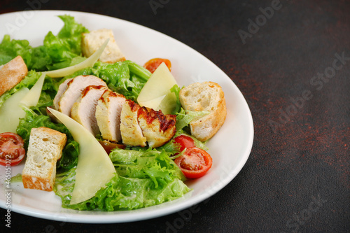 Caesar salad close up. chicken caesar salad with parmesan cheese