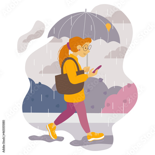 Vector illustration of a student girl with red hair walking with an umbrella in the rain and looking at her phone