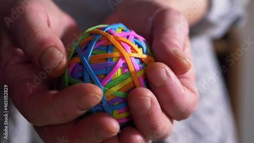 Wallpaper Mural Hand holding colorful rubber band ball Torontodigital.ca