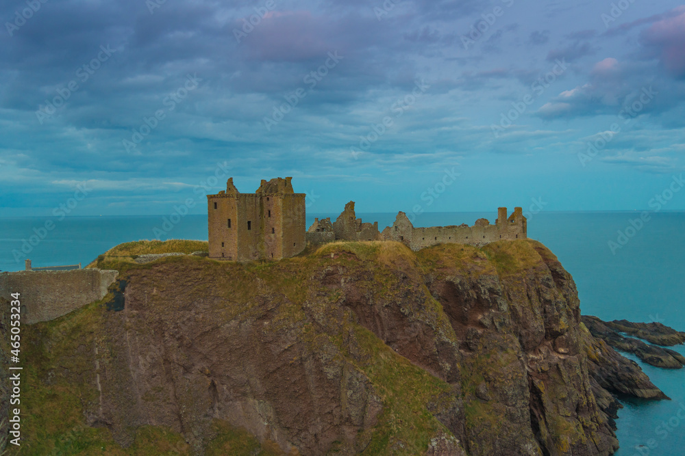 Dunnottar Castle is a ruined medieval fortress located upon a rocky headland on the north-eastern coast of Scotland south of Stonehaven.  Sunset Evening
