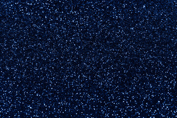 Blue sparkling glitter background, christmas abstract shiny texture. Holiday lights