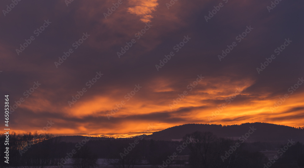 Obraz premium sunset - red sky above hilly landscape