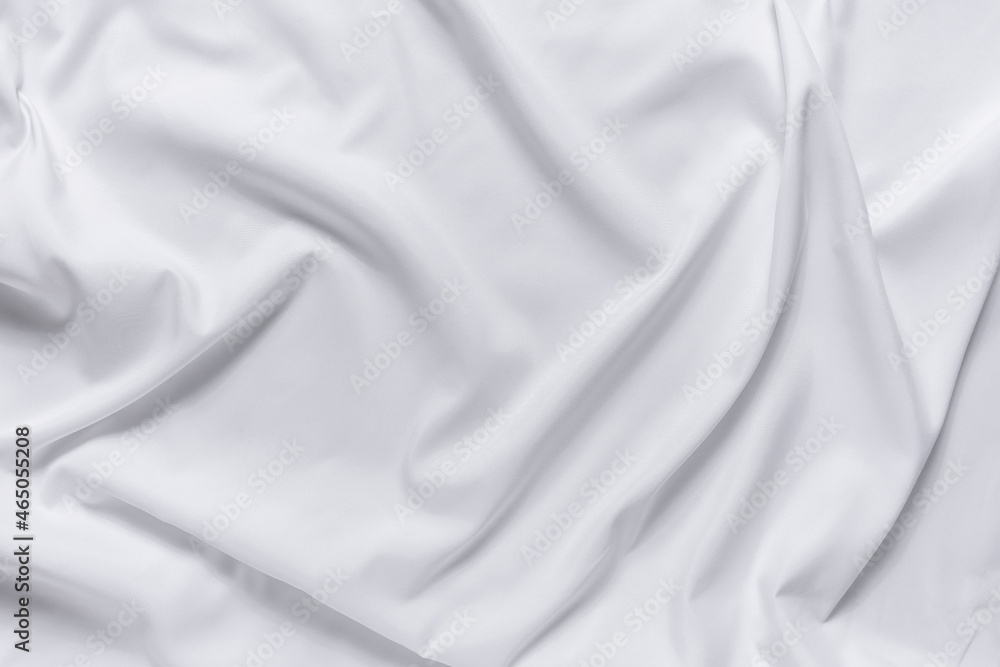 Abstract white fabric texture background. Cloth soft wave. Creases of satin, silk, and cotton.