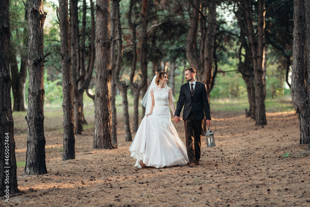 walk of the bride and groom through the autumn forest