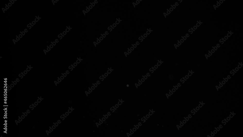 flying almonds infront of black background in slowmotion flying almonds infront of black background in slowmotion