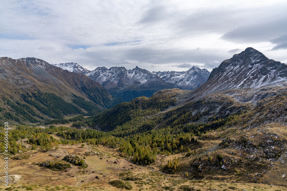 landscape view of the Val Poschiavo and southern Swiss Alps in late autun with first snow on the peaks