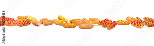 Set with delicious deep fried corn dogs on white background. Banner design photo