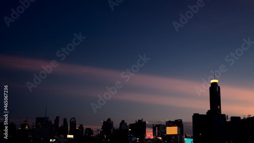 Vintage style modern city complex buildings skyscraper skyline in the sunset evening panoramic black dark background. Aerial view.