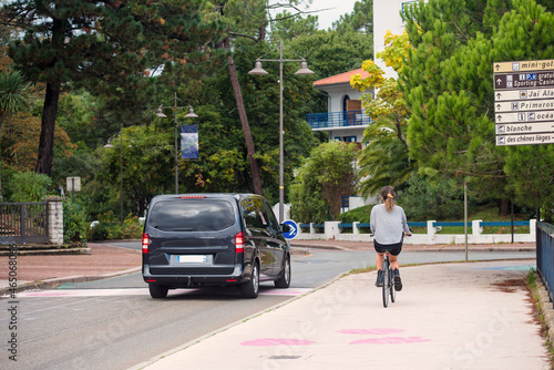 woman riding a bicycle in the city of Hossegor