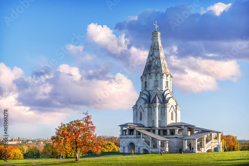 Golden autumn trees and the Ascension Church in Kolomenskoye park in Moscow on an autumn sunny day