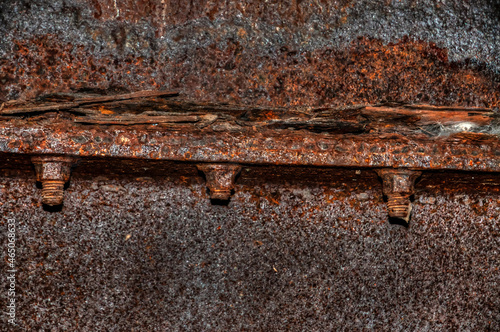 Rusty metal girder under a bridge