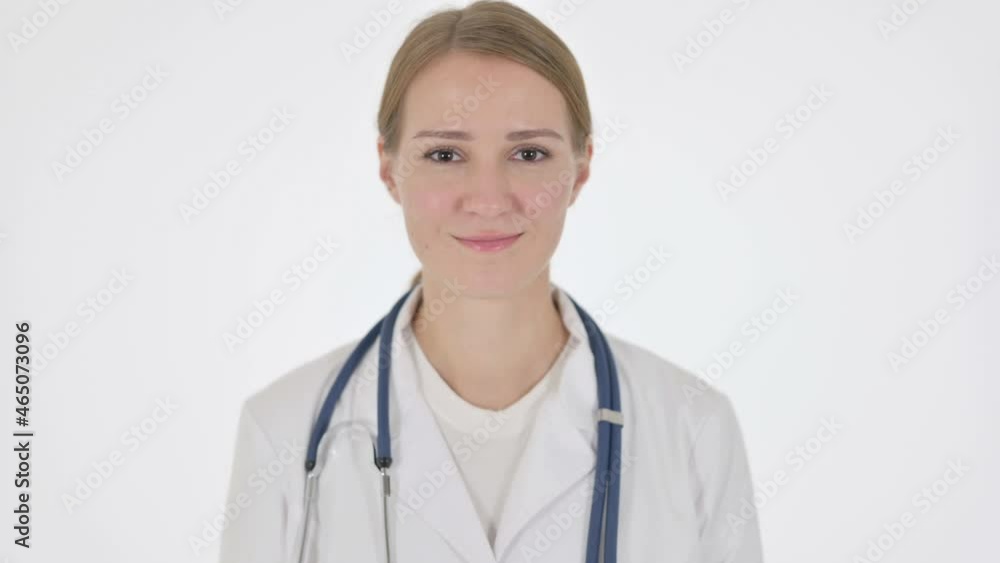 Female Doctor Shaking Head as Yes Sign on White Background Female Doctor Shaking Head as Yes Sign on White Background