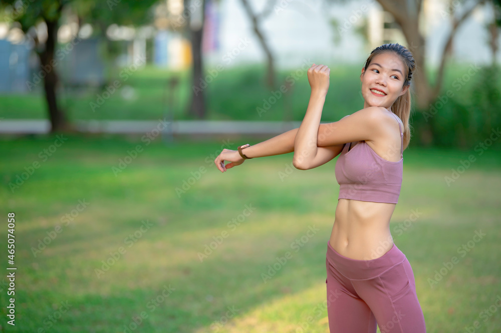Asian beautiful slim woman at the park,Young girl love healthy exercise,Teen wear sportswear
