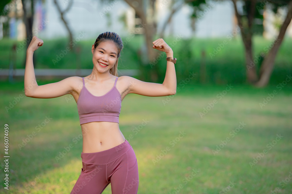 Asian beautiful slim woman at the park,Young girl love healthy exercise,Teen wear sportswear Asian beautiful slim woman at the park,Young girl love healthy exercise,Teen wear sportswear