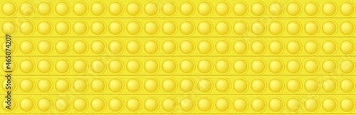 Popit yellow seamless pattern as a fashionable silicon fidget toy. Addictive anti-stress toy in bright color. Bubble popits for kids fingers. Vector illustration in rectangle format suitable for