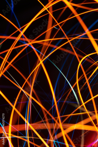 Abstract dynamic orange and blue light lines background