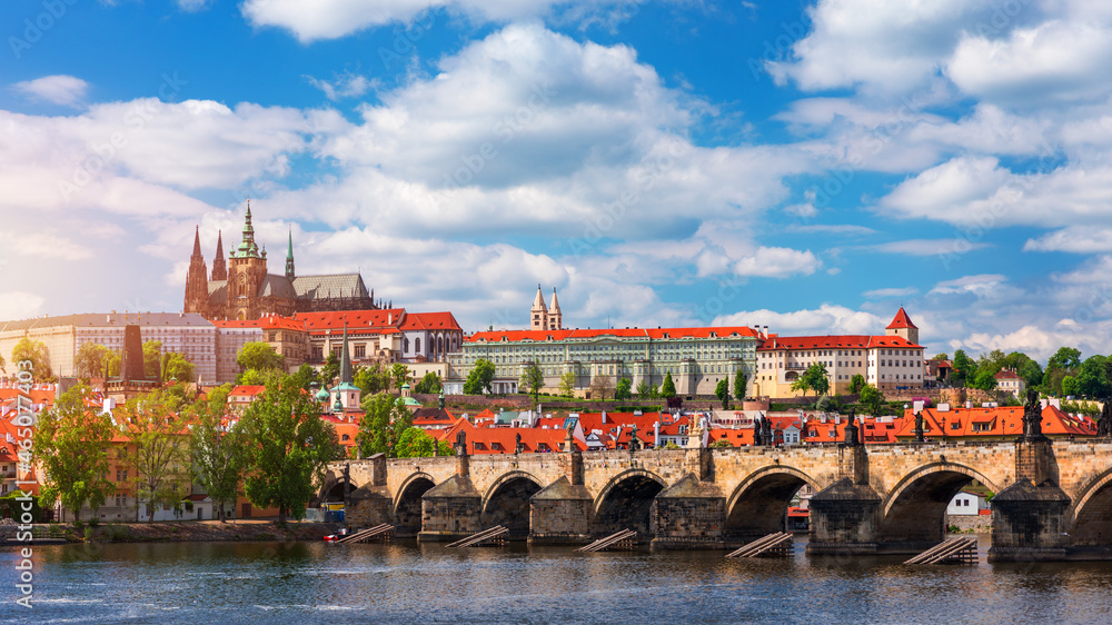 Prague scenic spring view of the Prague Old Town pier architecture Charles Bridge over Vltava river in Prague, Czechia. Old Town of Prague with the Castle in the background, Czech Republic.