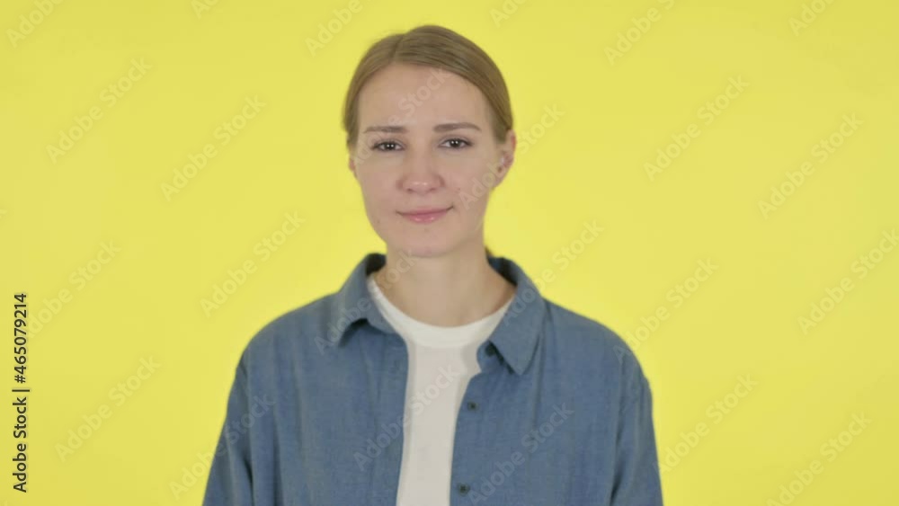 Young Woman Yawning on Yellow Background Young Woman Yawning on Yellow Background