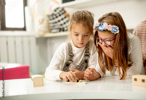Two cute little girls playi...