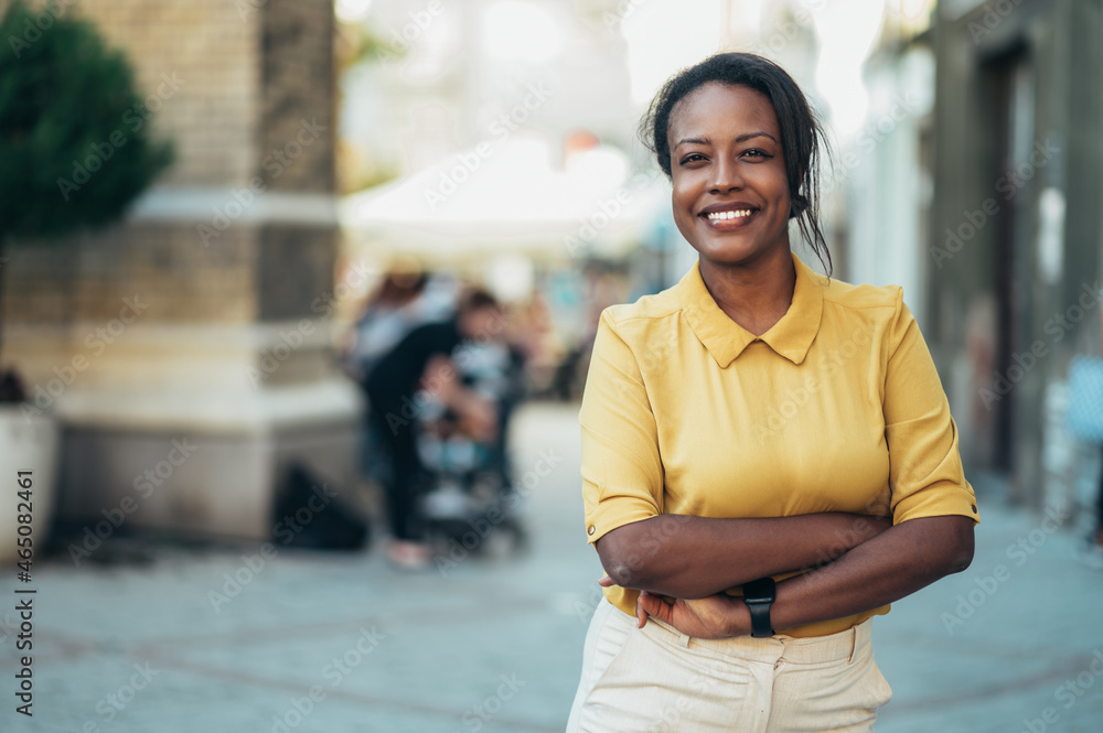 African american woman standing in the city street African american woman standing in the city street