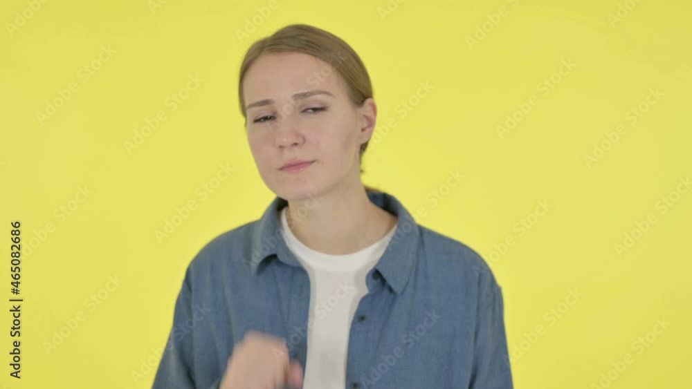 Young Woman Coughing on Yellow Background Young Woman Coughing on Yellow Background