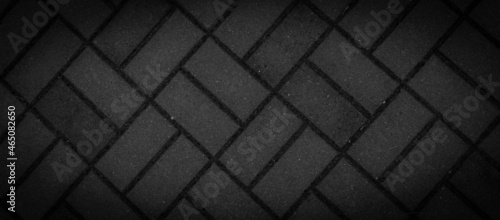 black paving stones with visible details. background © Krzysztof Bubel