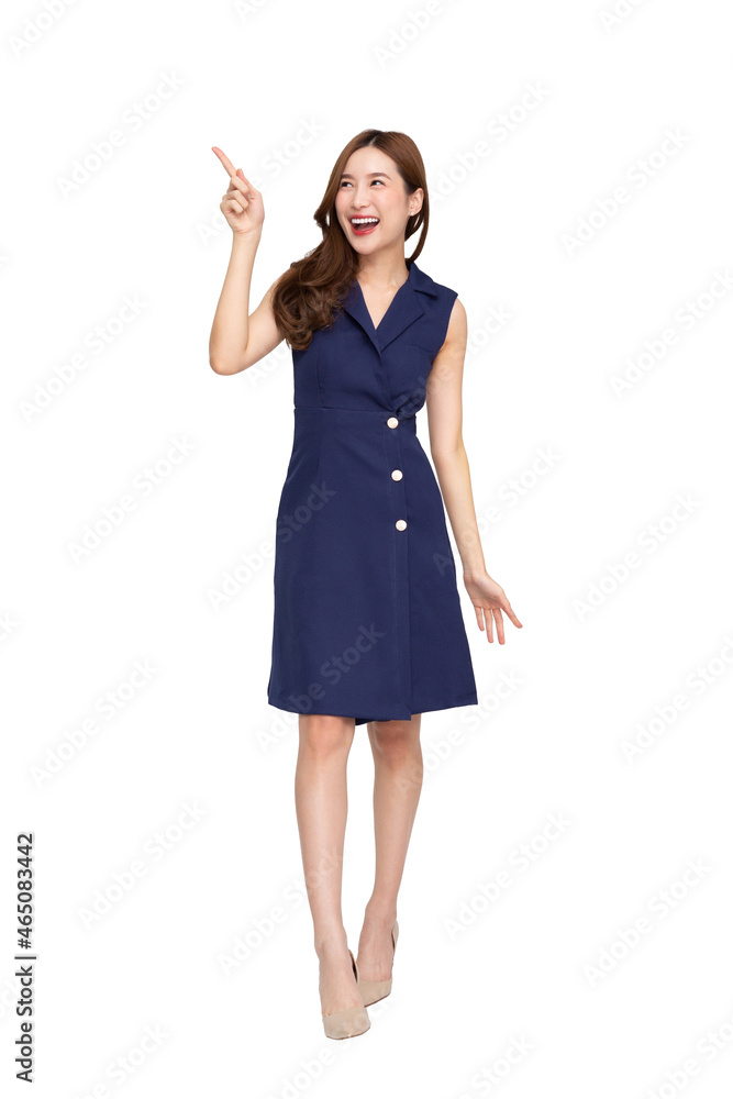 Young Asian woman smiling and pointing finger to empty copy space isolated on white background, Full body composition Young Asian woman smiling and pointing finger to empty copy space isolated on white background, Full body composition