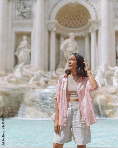 woman posing at the trevi fountain