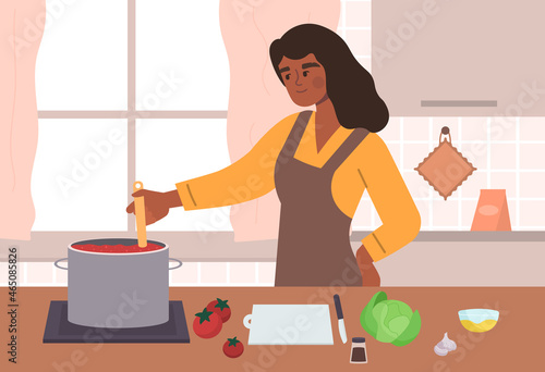 Woman cooking at kitchen