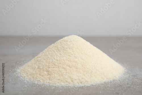 Pile of gelatin powder on grey table