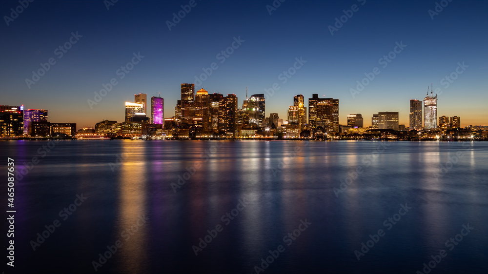 Naklejka premium Boston skyline at sunset from the East reflection