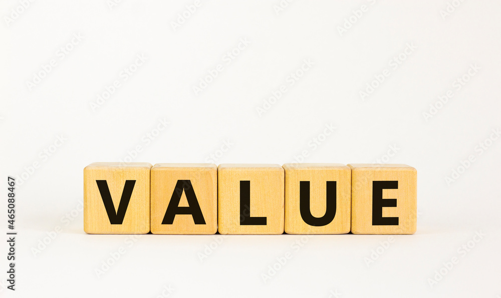 Value symbol. The concept word 'value' on wooden cubes on a beautiful white table, white background, copy space. Business and value concept. Value symbol. The concept word 'value' on wooden cubes on a beautiful white table, white background, copy space. Business and value concept.