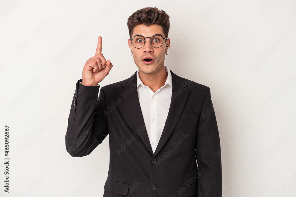 Young business caucasian man wearing headphones isolated on white background having an idea, inspiration concept. Young business caucasian man wearing headphones isolated on white background having an idea, inspiration concept.