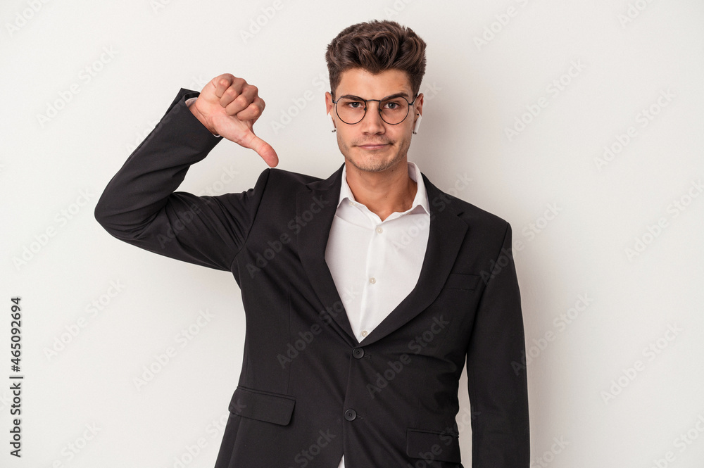 Young business caucasian man wearing headphones isolated on white background showing a dislike gesture, thumbs down. Disagreement concept. Young business caucasian man wearing headphones isolated on white background showing a dislike gesture, thumbs down. Disagreement concept.