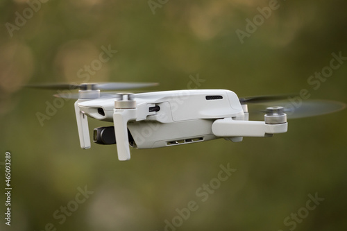 A dji mini 2 drone in action in jena at autumn, copy space