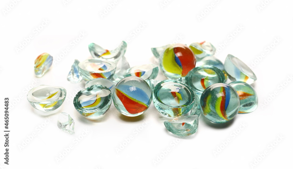 Pile of broken colorful glass marbles isolated on white 
