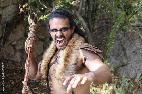 Fotografie Spooky primitive warrior with an axe