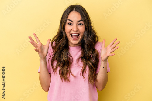 Young caucasian woman isolated on yellow background screaming to the sky, looking up, frustrated.