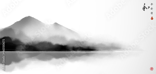 Landscape with misty mountains in water. Traditional oriental ink painting sumi-e, u-sin, go-hua. Hieroglyphs - peace, tranquility, clarity, harmony