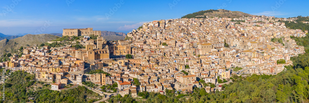 Panorama of Caccamo city, Sicily. Medieval Italian city with the Norman Castle in Sicily mountains, Italy. View of Caccamo town on the hill with mountains in the background, Sicily, Italy.