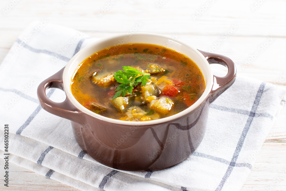 Soup with lentils and vegetables on a light table. Soup with lentils and vegetables on a light table.