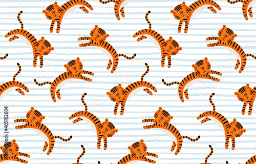 Cute cartoon jumping tigers, stripes, seamless pattern on white background. Hand drawn vector illustration. Flat style design. Concept kids textile, fashion print, wallpaper, packaging, 2022 New Year.