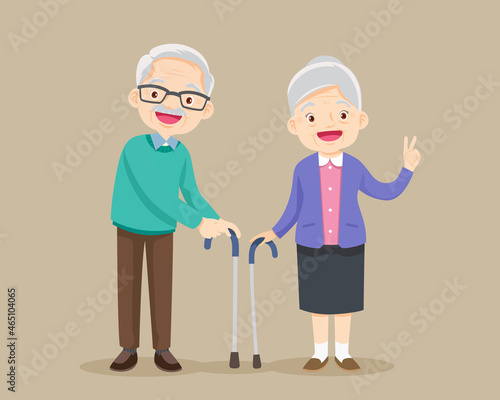 Grandmother and grandfather standing together with cane