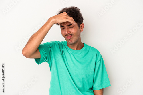 Young mixed race man isolated on white background touching temples and having headache.